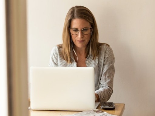 Woman typing at laptop
